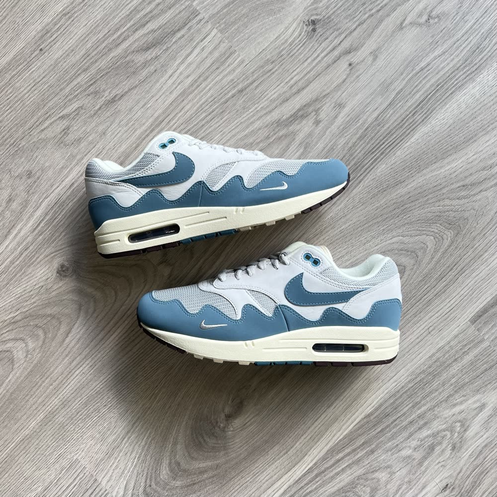 A pair of blue and white Nike Air Max 1 sneakers