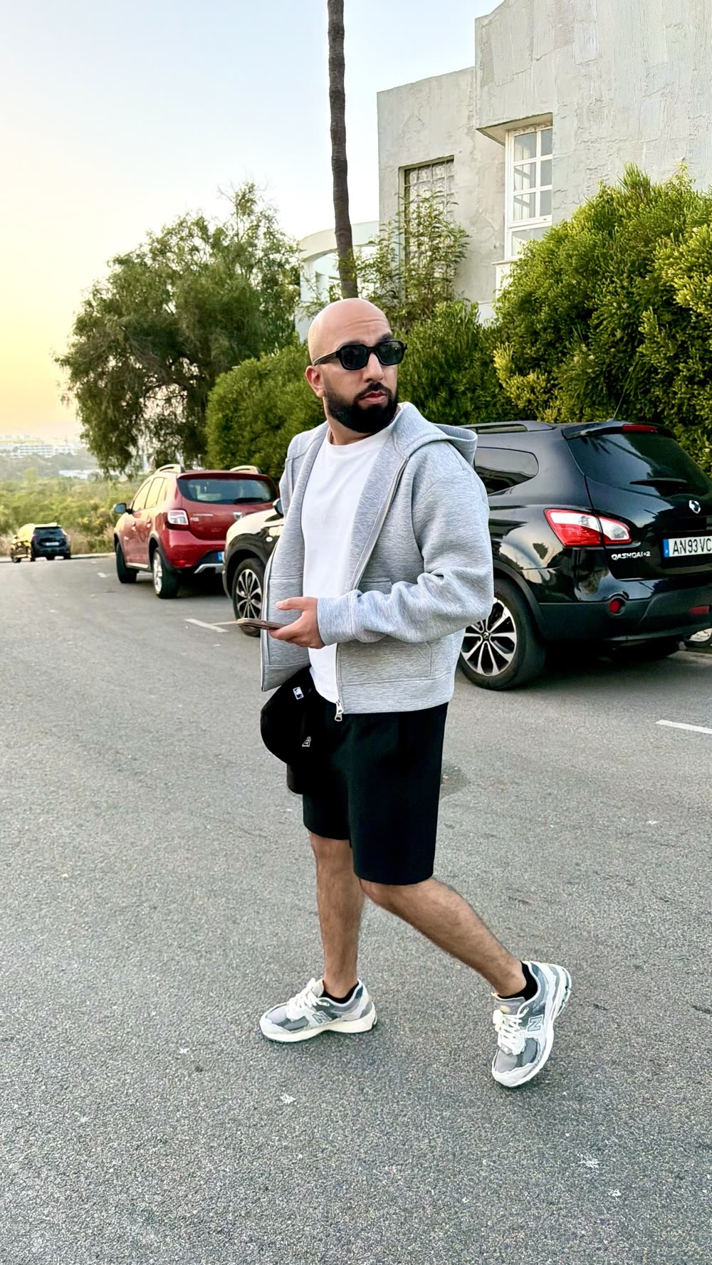 Sidarth walking down a street wearing a pair of sneakers